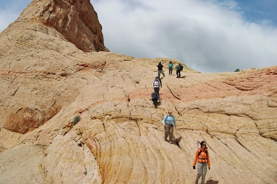 We hike through a wonderland of white Navajo sandstone sculpted into fascinating patterns.
