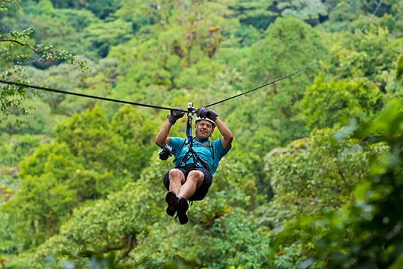 Zipping high above the trees is a rush and offers a bird's-eye view into the rainforest canopy.