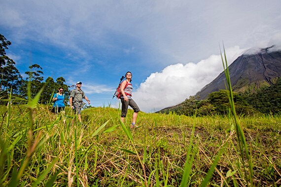 Trails through Arenal Volcano National Park weave through fields and forests, over old lava flows, and offer great views on a clear day.