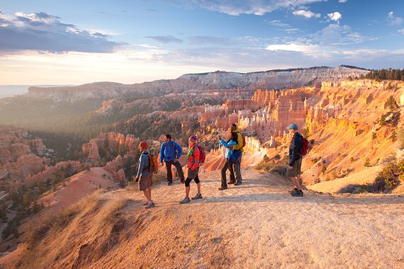 From the Virgin River, leave the bike behind and climb the trail to Angel's Landing, beginning with a long and winding ascent up "Walter's Wiggles."