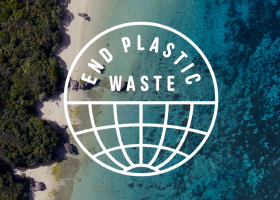 Overhead view of a beach shoreline with the adidas END PLASTIC WASTE logo superimposed.
