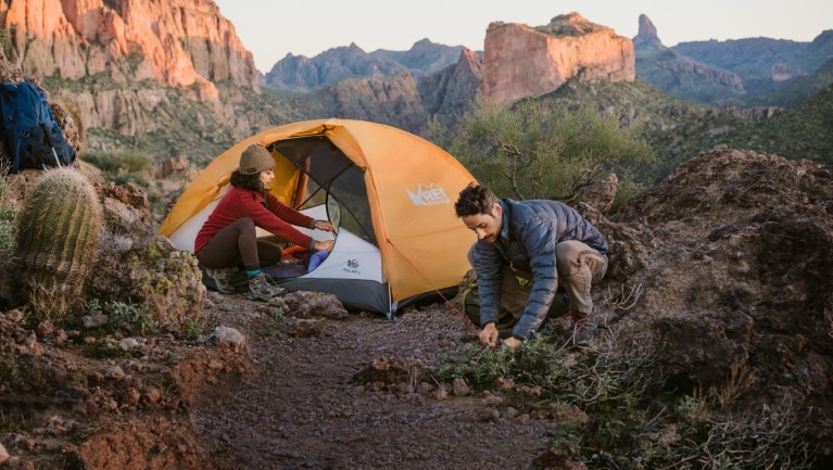 Two hikers setup a backcountry camp