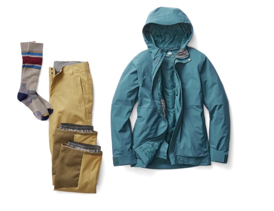 R E I Co-op brand snow jacket, snow pants, and socks are shown against a transparent background