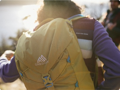 A close view of a person wearing a backpack.