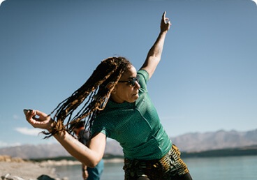 A person skipping a rock across water
