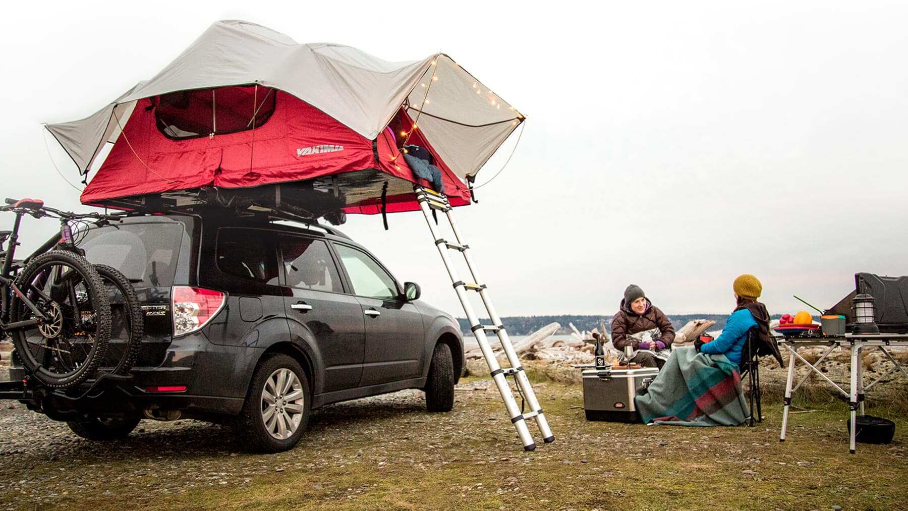 A Yakima Skyrise rooftop tent fully assembled on a S U V