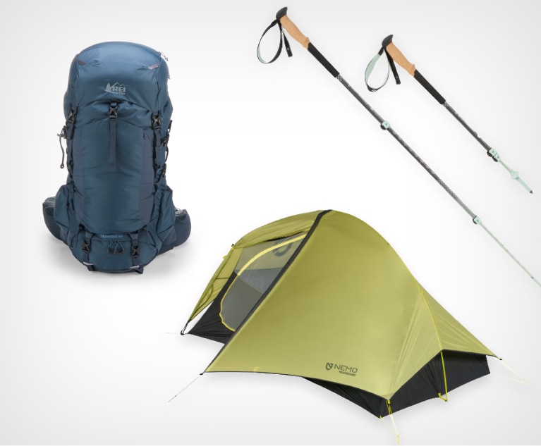 A tent, trekking poles, hiking pack and shoes.