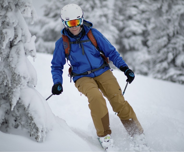 A skier races down a run