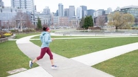 Running through a city park.