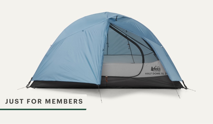 A blue R E I Co-op brand half dome tent