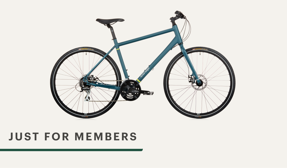 A blue Co-op Cycles C T Y 1.1 bike.