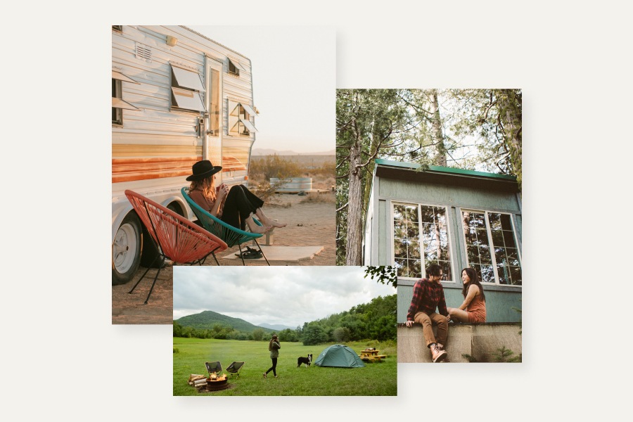 A camper stands in a verdant field near a dog, tent, picnic table and campfire with two chairs.