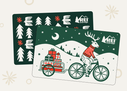 R E I holiday gift cards surrounded by hand-drawn winter illustrations.