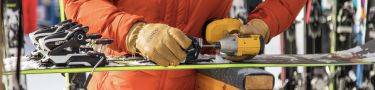 REI technician fixing a ski board