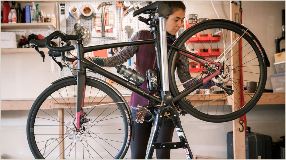 REI technician fixing a bike