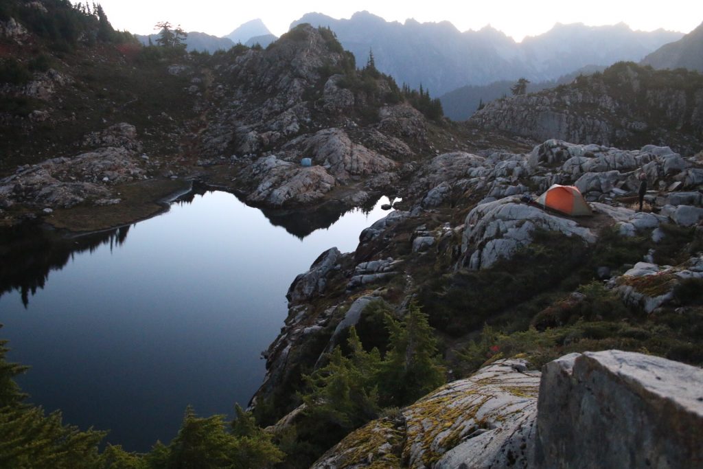 A tent near an alpine lake