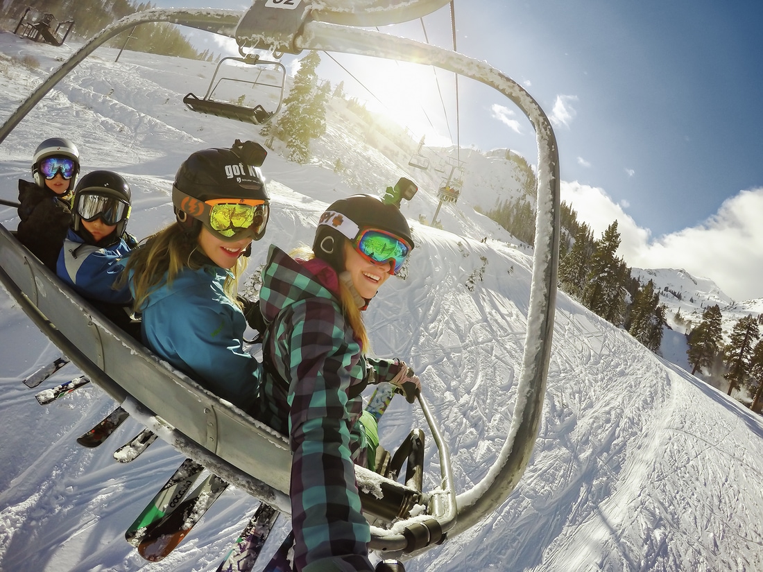 Younger folks on a chairlift at a ski resort