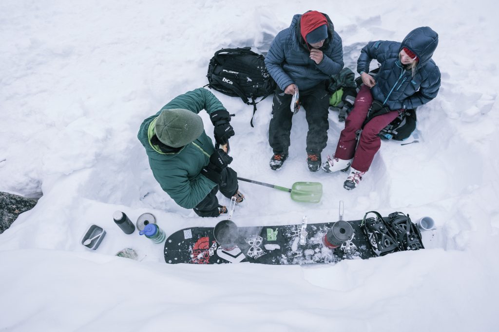 People cooking in snow