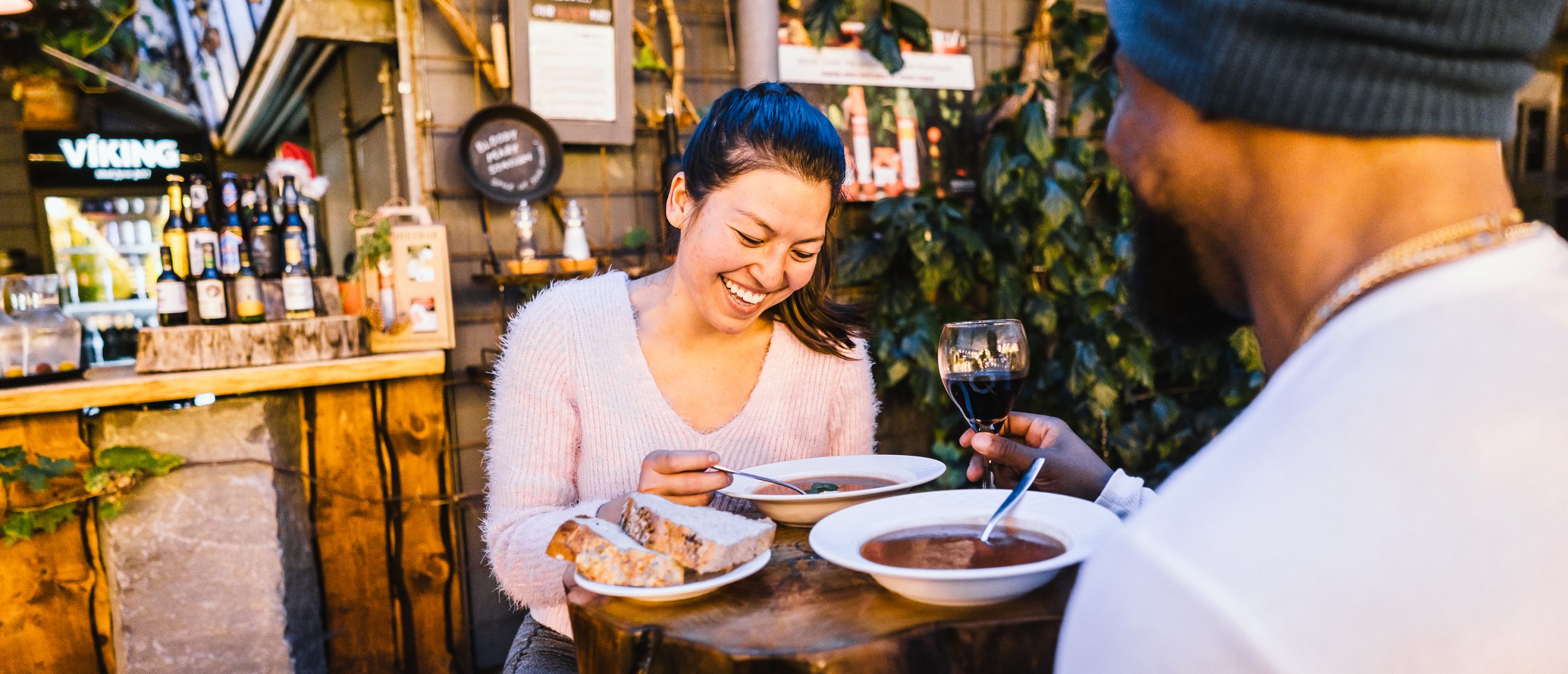 A traveling couple dines at sunset.