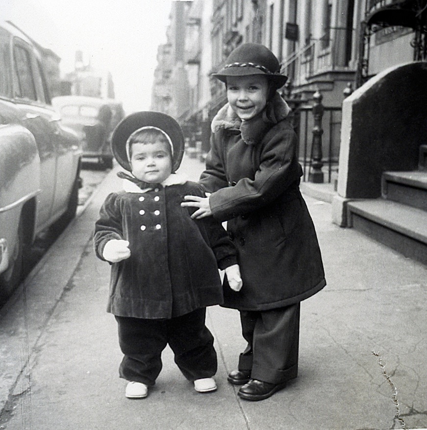 Dierdre Wolownick as a child poses with her brother John in front of the family Manhattan brownstone.