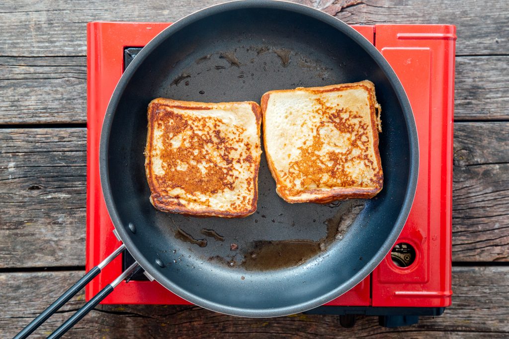 French toast in pan cooking