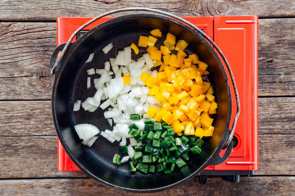 Sauteeing onions and peppers in pan
