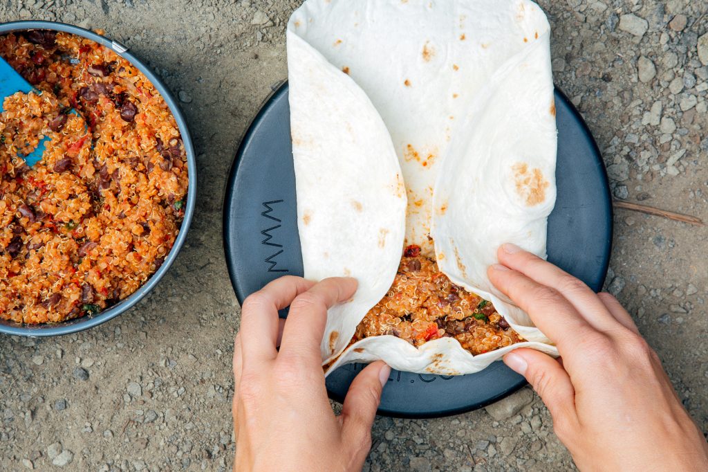 Backpacking burrito bowl, rolling up in a tortilla