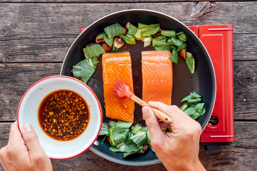 Coating salmon in soy glaze