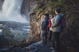 Hikers looking at a waterfall