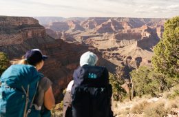 Backpackers gaze into the depths of the Grand Canyon.