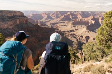 Backpackers gaze into the depths of the Grand Canyon.