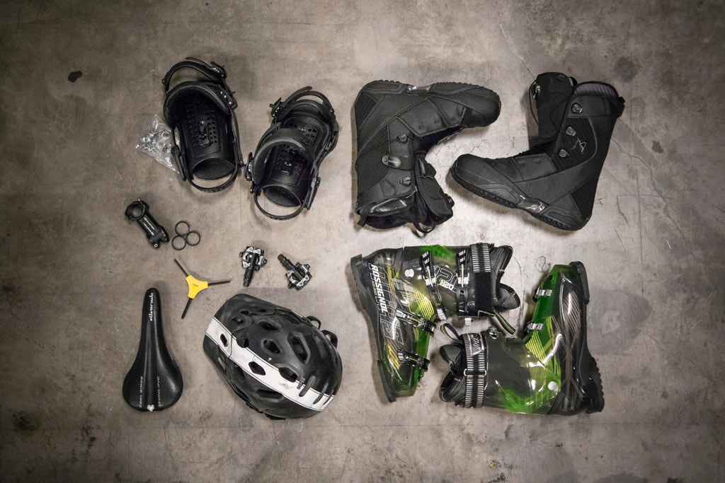 Bike and snowboard gear on concrete floor