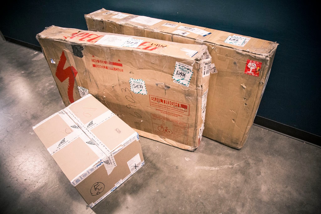 Two bike boxes and one smaller box