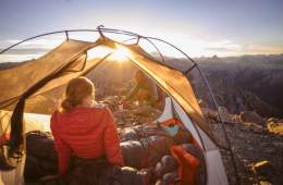 Two backpackers in a tent