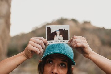 Asia holding a polariod