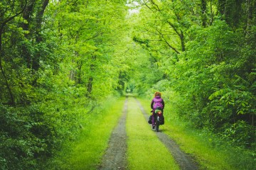 Abby Taylor riding her bike on the Packing It Out 2017 tour