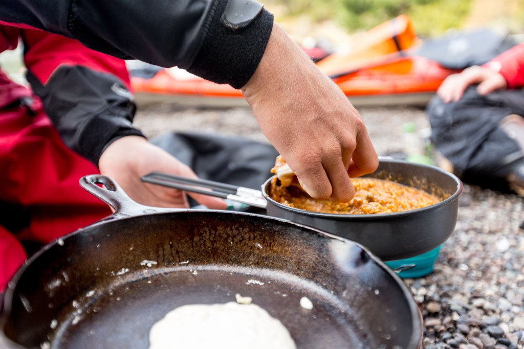 Dipping the pancake in the curry