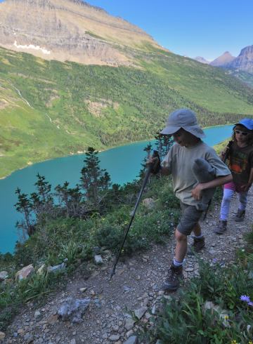 Nate and Alex hike along Gunsight Pass Trail in Glacier National Park