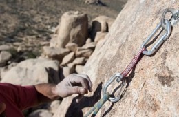 climber placing a quickdraw