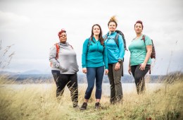 Four women standing in a field