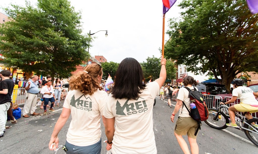 Becky Smith, general manager for the REI flagship store in Washington, D.C., held her partner's hand.
