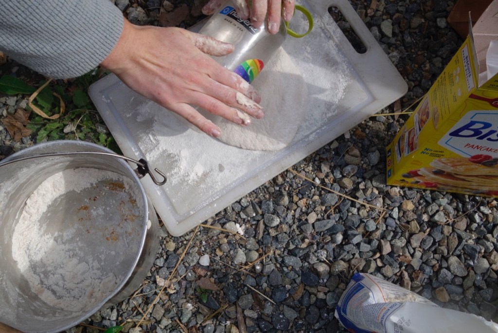 Rolling the dough with a Nalgene bottle.