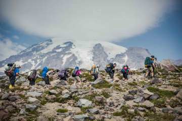 Hikers on a snowcapped volcano