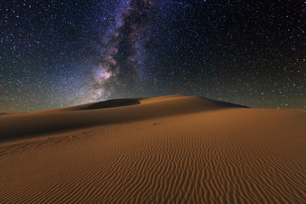 Starry Sky over the sand dunes. Gobi Desert.