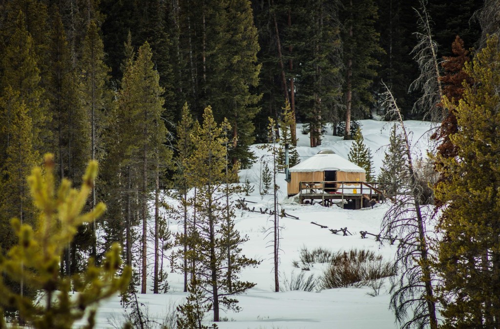 Dancing Moose Yurt with a blanket of snow on the ground.