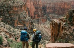 Two hikers gazing out at Grand Canyon National Park