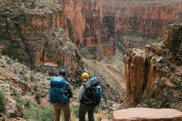Two hikers gazing out at Grand Canyon National Park