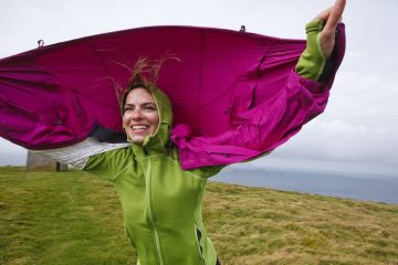 A woman enjoys the windy Ireland weather.