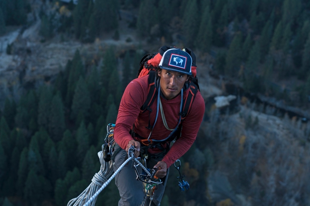 Jimmy Chin jumars up the wall of El Capitan, while wearing a backpack.