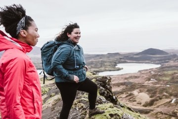 Travelers gaze over a scoured plain in Iceland.